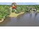 Stunning lakefront home with mature trees and lush greenery, offering serene views and privacy at 70 Lake Charles Xing, Covington, GA 30016