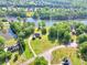 Aerial shot showing expansive 2.75-acre lot, lakefront property and surrounding trees at 70 Lake Charles Xing, Covington, GA 30016