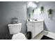 Bathroom featuring a white vanity and a coordinated black and grey color scheme for a sleek look at 70 Lake Charles Xing, Covington, GA 30016