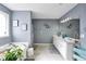 Bright bathroom featuring a soaking tub, double vanity, and elegant decorative touches for a relaxing spa-like experience at 70 Lake Charles Xing, Covington, GA 30016