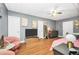 A bedroom offering a cozy bed, comfortable seating, and a wall-mounted TV for entertainment at 70 Lake Charles Xing, Covington, GA 30016
