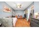 A bedroom offering a cozy bed, comfortable seating, and a wall-mounted TV for entertainment at 70 Lake Charles Xing, Covington, GA 30016