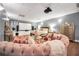 Home bedroom with a large tv screen and a comfy-looking circular pink couch with pink accents at 70 Lake Charles Xing, Covington, GA 30016