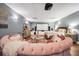 Home bedroom with a large tv screen and a comfy-looking circular pink couch with pink accents at 70 Lake Charles Xing, Covington, GA 30016