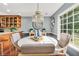 Inviting dining area with an open layout, hardwood floors, and scenic backyard views at 70 Lake Charles Xing, Covington, GA 30016