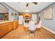 Dining area showcasing wood cabinets and access to the kitchen with white appliances at 70 Lake Charles Xing, Covington, GA 30016