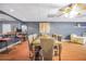Elegant dining area features a large table, seating for eight, and a stylish bar for entertaining at 70 Lake Charles Xing, Covington, GA 30016