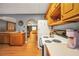 Traditional kitchen with wood cabinets and white appliances offering functional workspace at 70 Lake Charles Xing, Covington, GA 30016