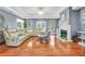Bright living room features hardwood floors, a fireplace, recessed lighting, and modern décor throughout at 70 Lake Charles Xing, Covington, GA 30016