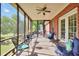 Relax on this screened-in patio and enjoy beautiful lake views in a tranquil backyard setting at 70 Lake Charles Xing, Covington, GA 30016