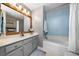 Bathroom with a large vanity, a tub and shower combo, and neutral paint for a soothing effect at 164 Stoneforest Dr, Woodstock, GA 30189