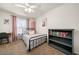 Bedroom featuring natural light, a ceiling fan, and decor at 164 Stoneforest Dr, Woodstock, GA 30189