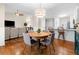 Bright dining area with hardwood floors open to the kitchen and living areas, which makes for easy entertaining at 164 Stoneforest Dr, Woodstock, GA 30189