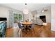 Open dining area with hardwood floors and access to an outdoor deck that is great for entertaining at 164 Stoneforest Dr, Woodstock, GA 30189