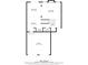 Detailed floor plan showcasing layout of the first floor including living room, kitchen, and garage at 164 Stoneforest Dr, Woodstock, GA 30189