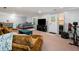 Spacious finished basement area with a comfy couch and television at 164 Stoneforest Dr, Woodstock, GA 30189