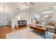 Bright and open living area with hardwood floors, a comfortable sofa, and access to the kitchen at 164 Stoneforest Dr, Woodstock, GA 30189