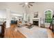 Spacious living room with hardwood floors, fireplace, high ceilings, and plenty of natural light at 164 Stoneforest Dr, Woodstock, GA 30189