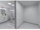 Bathroom featuring marble floors, seamless shower doors, and a modern vanity at 1819 Waldrep Se Cir, Marietta, GA 30060