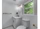 Bathroom features modern vanity, sleek mirror, and great natural light at 1819 Waldrep Se Cir, Marietta, GA 30060