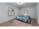 A comfortable bedroom with wood floors, natural light, and soft bedding, inviting relaxation at 1819 Waldrep Se Cir, Marietta, GA 30060