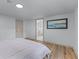 Bedroom featuring light wood floors, white walls, and ensuite bathroom at 1819 Waldrep Se Cir, Marietta, GA 30060