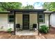 Home exterior featuring a cozy porch and a seating area with black chairs at 1819 Waldrep Se Cir, Marietta, GA 30060