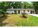 Traditional home boasts a well maintained lawn and updated exterior paint at 1819 Waldrep Se Cir, Marietta, GA 30060