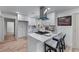 Updated kitchen with island seating and modern overhead vent at 1819 Waldrep Se Cir, Marietta, GA 30060
