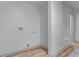 A bright laundry room featuring essential hookups against fresh, neutral walls at 1819 Waldrep Se Cir, Marietta, GA 30060