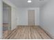 A spacious room showcasing modern wood flooring, neutral walls, and ample lighting at 1819 Waldrep Se Cir, Marietta, GA 30060