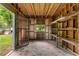 Spacious shed with wood beam construction, shelving, and natural light at 1819 Waldrep Se Cir, Marietta, GA 30060