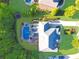 Aerial view of the roof, backyard featuring a pool and spa, and front driveway at 2325 Manor Creek Ct, Cumming, GA 30041