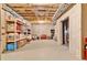 Unfinished basement with concrete floors and walls, featuring shelving for storage at 2325 Manor Creek Ct, Cumming, GA 30041