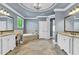 Large bathroom with double vanities and soaking tub features high ceilings and plenty of natural light at 2325 Manor Creek Ct, Cumming, GA 30041