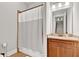 Bathroom featuring a shower and vanity with wood cabinets and a granite countertop at 2325 Manor Creek Ct, Cumming, GA 30041