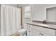 Bright bathroom with a shower, tile floors, a toilet, and granite countertops at 2325 Manor Creek Ct, Cumming, GA 30041