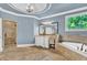 Luxury bathroom with a modern soaking tub, glass-enclosed shower, and elegant vanity, offering a spa-like experience at 2325 Manor Creek Ct, Cumming, GA 30041