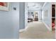 Elegant Primary suite featuring soft blue walls, a tray ceiling, and an inviting entrance to a spacious walk-in closet at 2325 Manor Creek Ct, Cumming, GA 30041