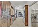Large walk-in closet with custom shelving, hanging rods, and a built-in laundry area, offering ample storage space at 2325 Manor Creek Ct, Cumming, GA 30041