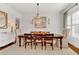 Elegant dining room with chandelier and natural light at 2325 Manor Creek Ct, Cumming, GA 30041