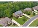 Beautiful brick home with meticulously landscaped backyard featuring a pool, hot tub, and patio at 2325 Manor Creek Ct, Cumming, GA 30041