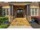 Inviting entryway with stone steps and elegant double doors at 2325 Manor Creek Ct, Cumming, GA 30041