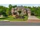 Beautiful brick home boasts mature trees, manicured landscaping, and attached garage at 2325 Manor Creek Ct, Cumming, GA 30041