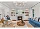 Cozy living room with fireplace and built-in shelving at 2325 Manor Creek Ct, Cumming, GA 30041