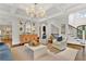 Spacious living room with large windows and coffered ceilings at 2325 Manor Creek Ct, Cumming, GA 30041