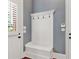 Mudroom with beadboard bench, hooks, and built in storage at 2325 Manor Creek Ct, Cumming, GA 30041