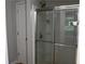 Bathroom showcasing a modern glass-enclosed shower and separate linen closet, offering both style and function at 2476 Suwanee Pointe Dr, Lawrenceville, GA 30043