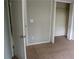 Bright bedroom with neutral carpeting and a spacious closet for ample storage at 2476 Suwanee Pointe Dr, Lawrenceville, GA 30043