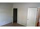 Neutral bedroom featuring carpet flooring and open doors at 2476 Suwanee Pointe Dr, Lawrenceville, GA 30043